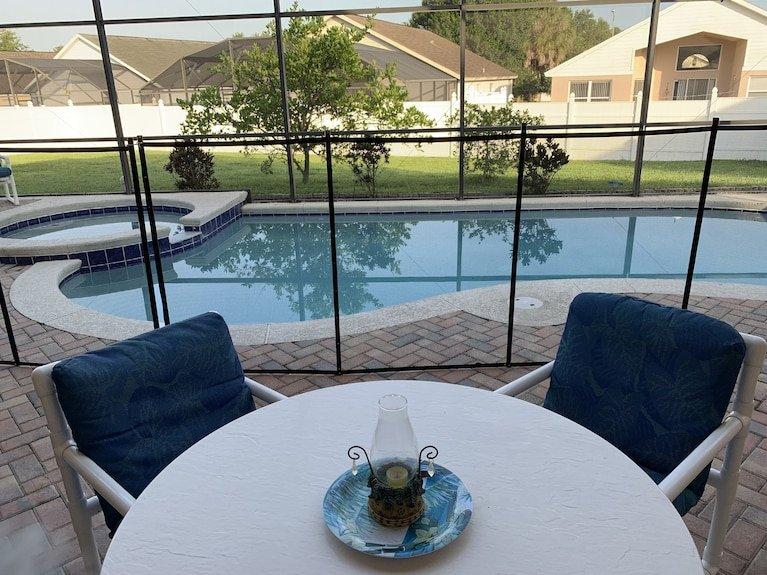 A fenced pool and yard at a pet-friendly Orlando vacation rental